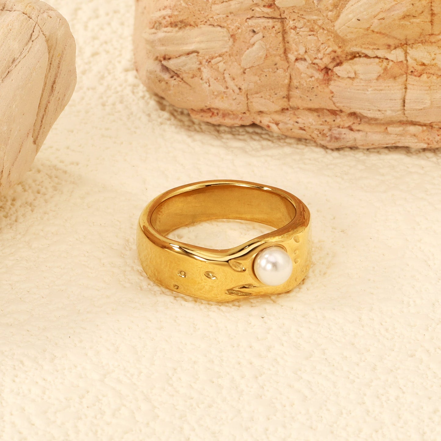 Gold-colored ring with a pearl surface asonjewelry