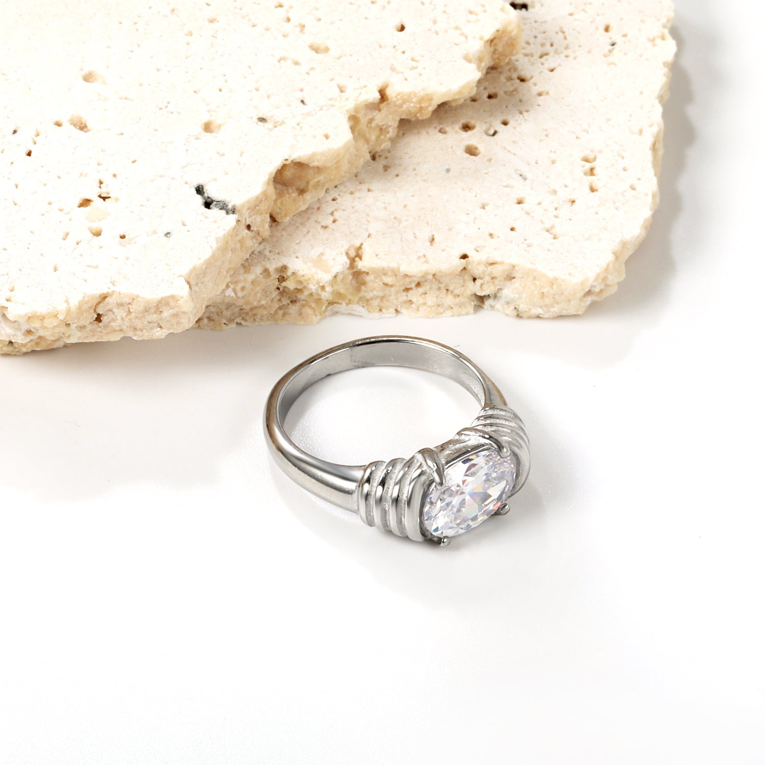 Oversized white oval diamonds on a threaded band ring. asonjewelry