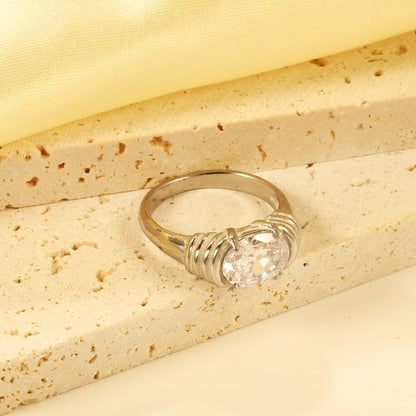 Oversized white oval diamonds on a threaded band ring. asonjewelry