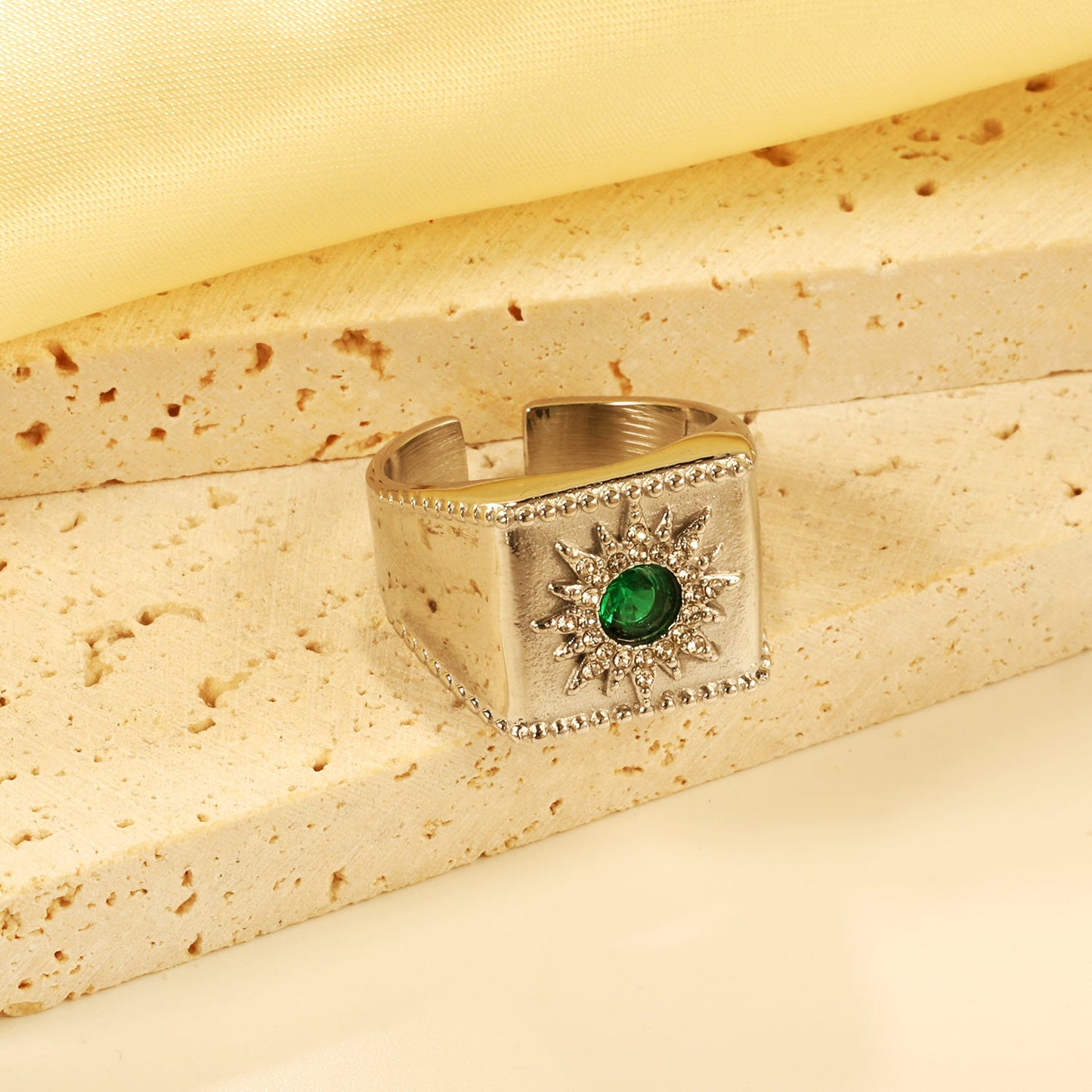 Exaggerated ring with green diamonds and engraved stamens. asonjewelry