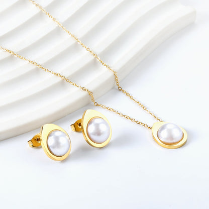 Teardrop shaped jewelry set with half white pearl steel color / gold asonjewelry