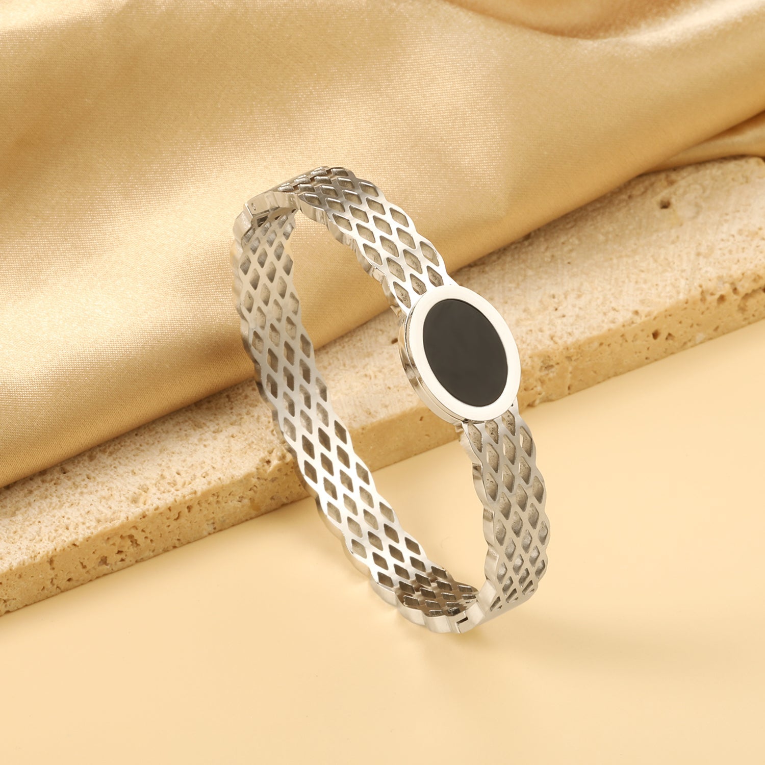 Woven mesh bracelet with black round oil drops. asonjewelry