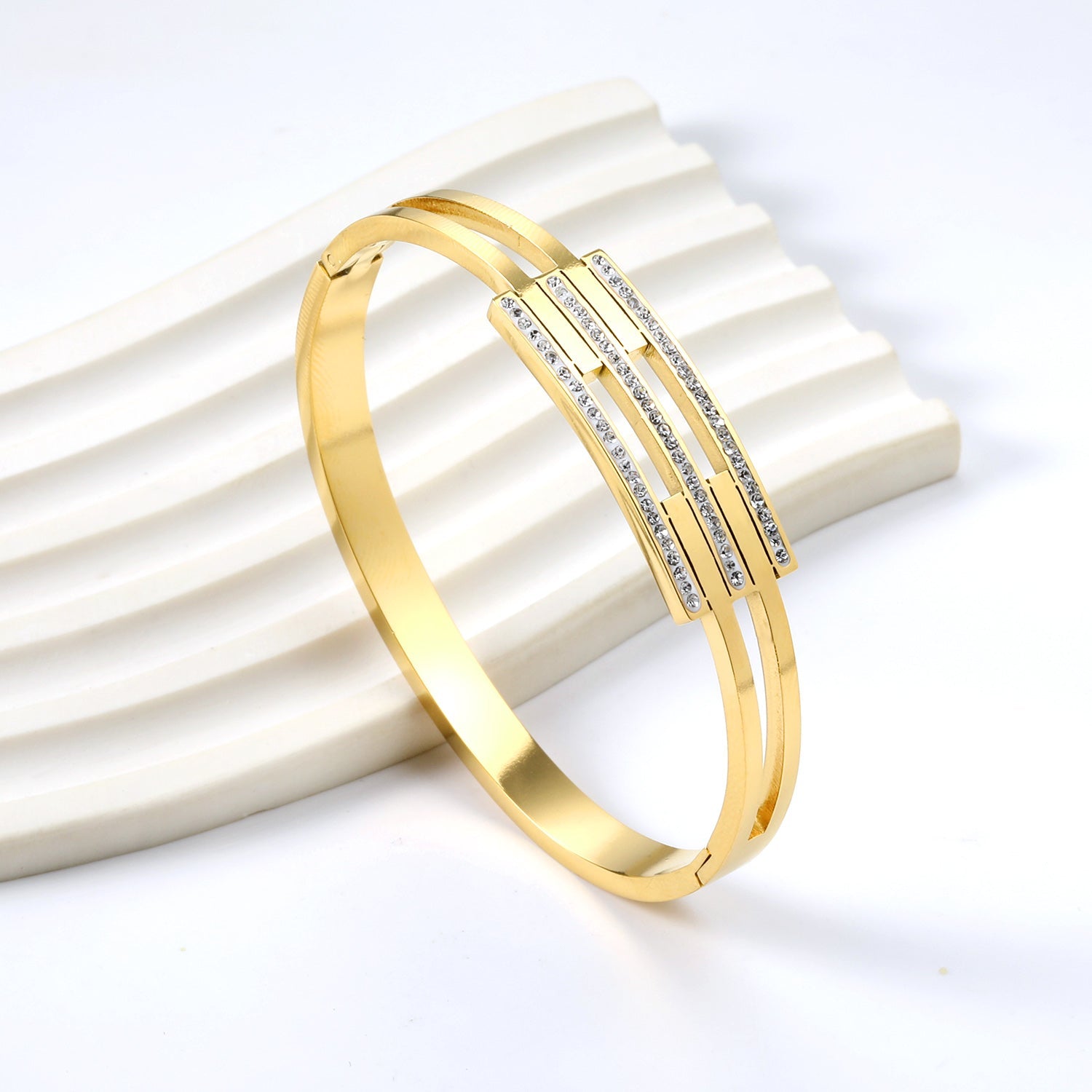 Hard bracelet with three small diamond-set bars asonjewelry