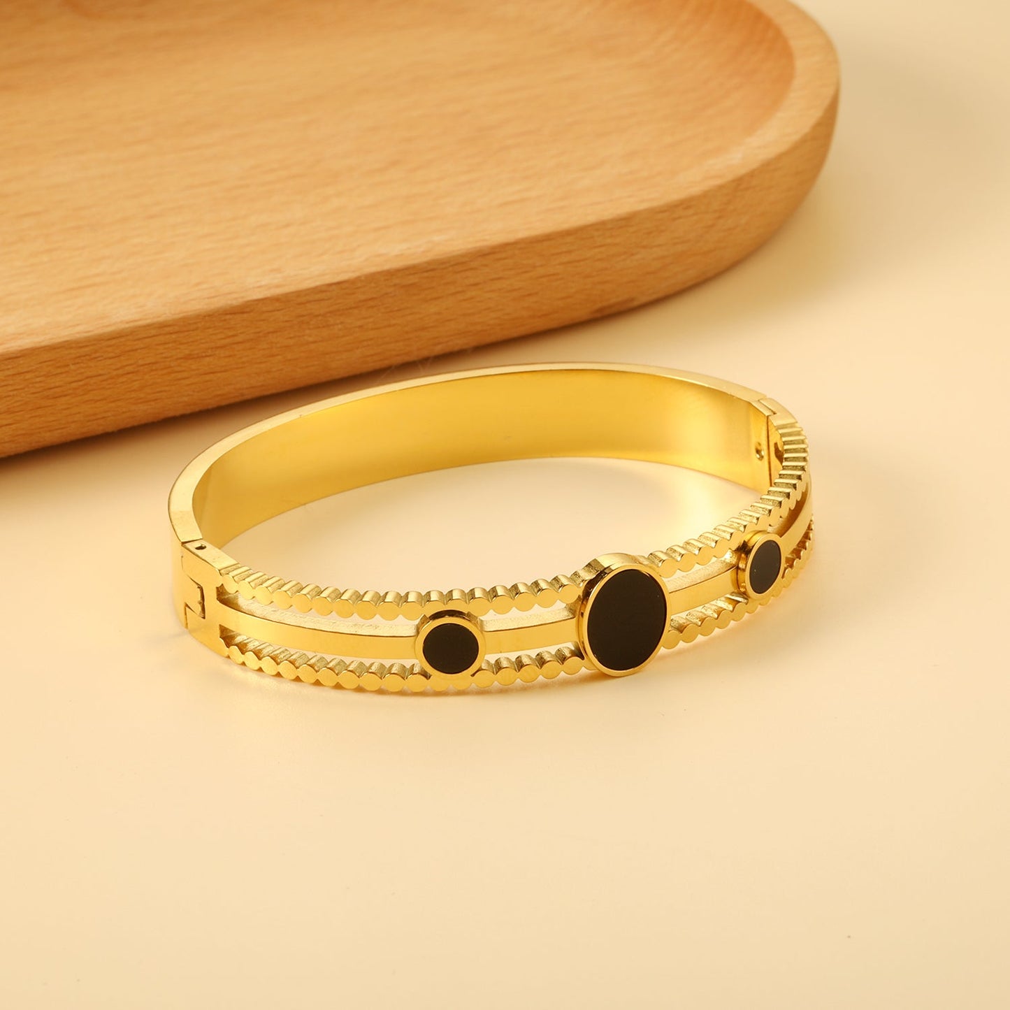 Chunky bracelet with three black oil-dripping circles asonjewelry