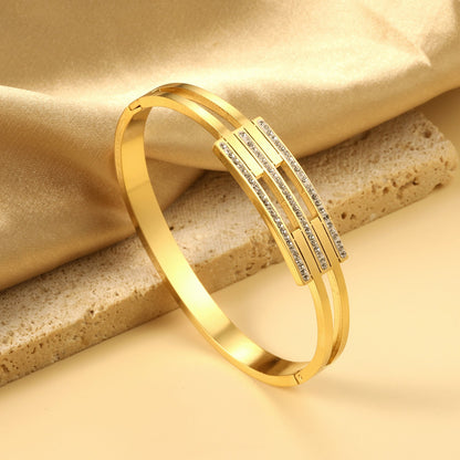 Hard bracelet with three small diamond-set bars asonjewelry