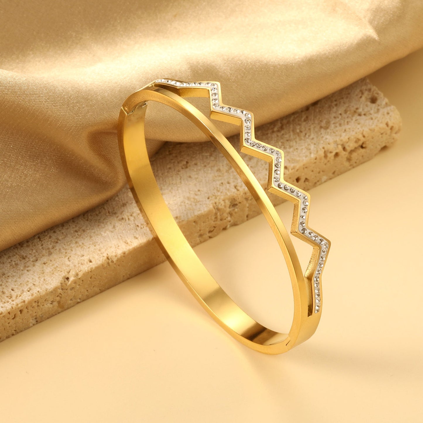 Wavy, diamond-studded hard bracelet like a crown asonjewelry