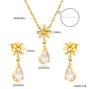 Flower + drop white diamond set Steel / Gold Earrings: 8.3mm flower + 6.2*10mm drop white diamond Pendant: 8.9mm flower + 6.2*10mm drop white diamond 0.3 Cross chain 42+5cm+6mm round plate