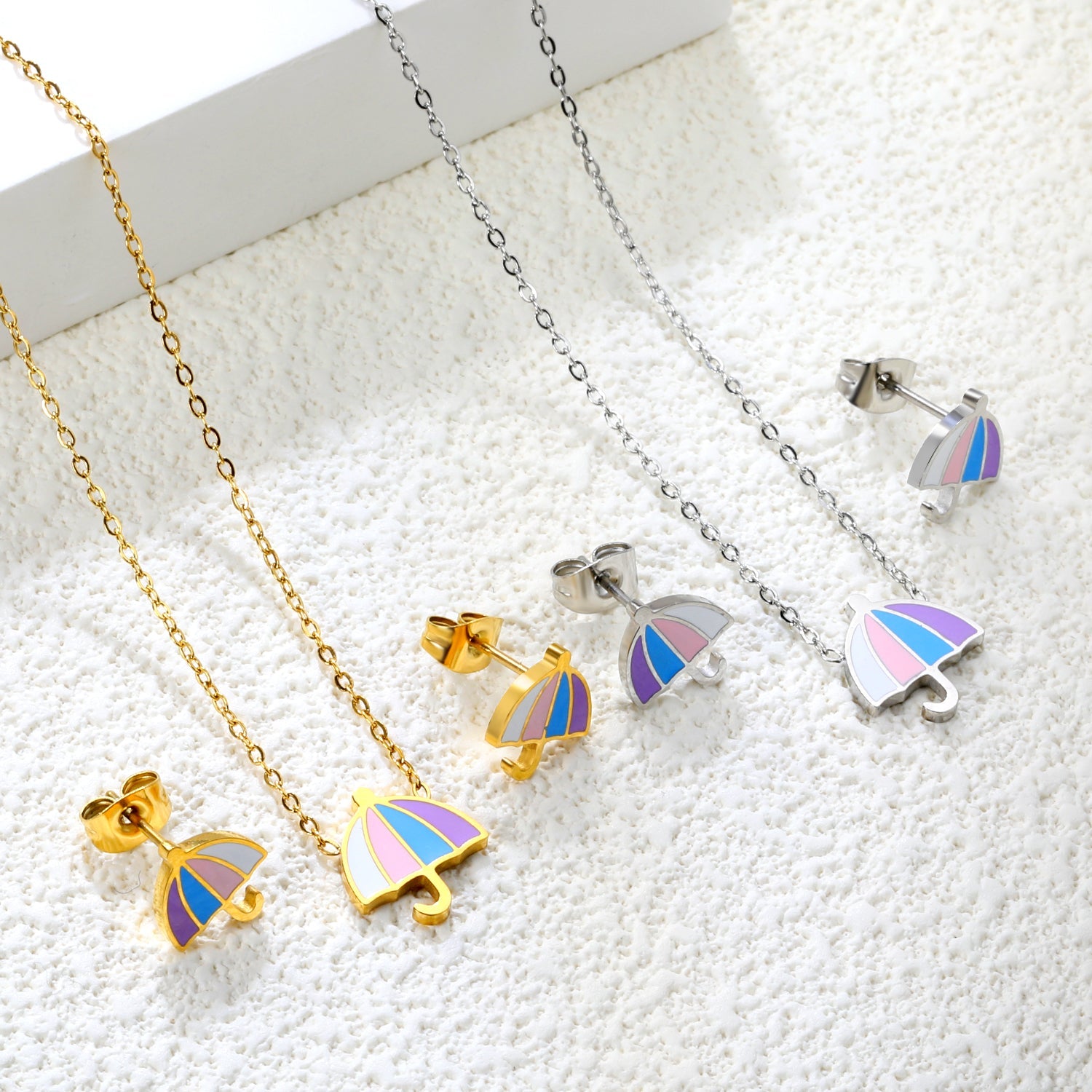 Umbrella set steel color/golden stud earrings: 9.3*10.3mm pendant: 11*12.1mm0.3 cross chain 42+5cm+6mm round plate asonjewelry