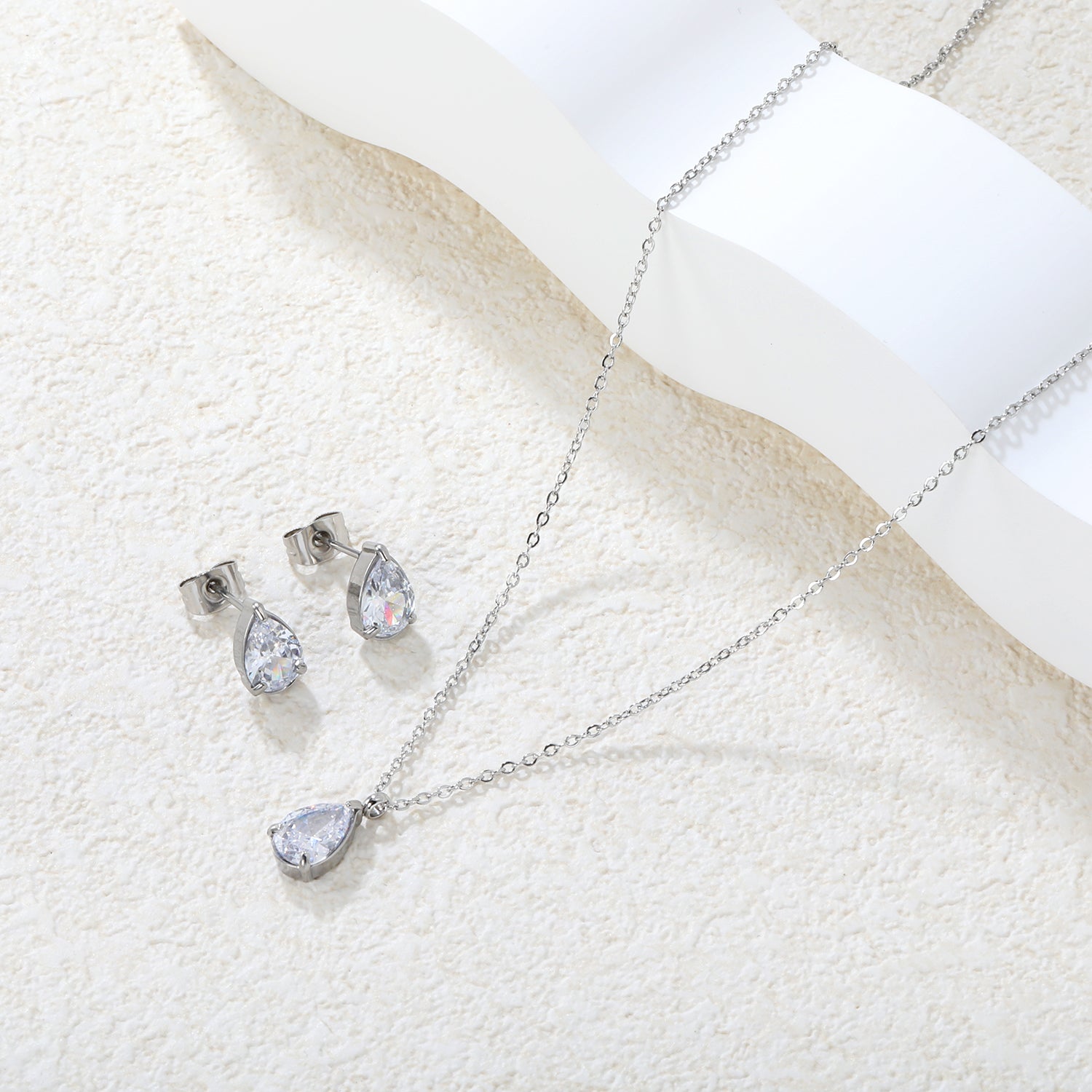 Teardrop White Zircon Set Gold/Steel-Tone Studs: 6.1*9.4mm Pendant: 6.1*9.4mm 0.3ct Cross Chain 40+5cm + 6mm Round Tag asonjewelry