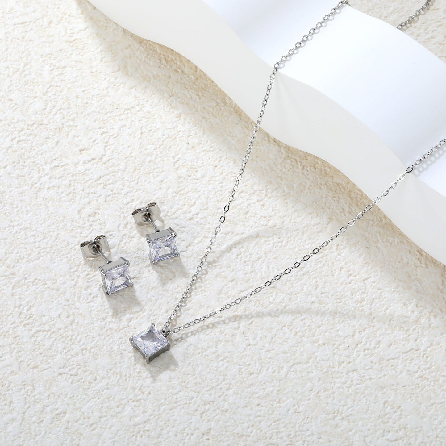 Square Zirconia Set Gold/Steel Tone Studs: 7mm Pendant: 7mm 0.3ct Cross Chain 40+5cm + 6mm Round Tag asonjewelry
