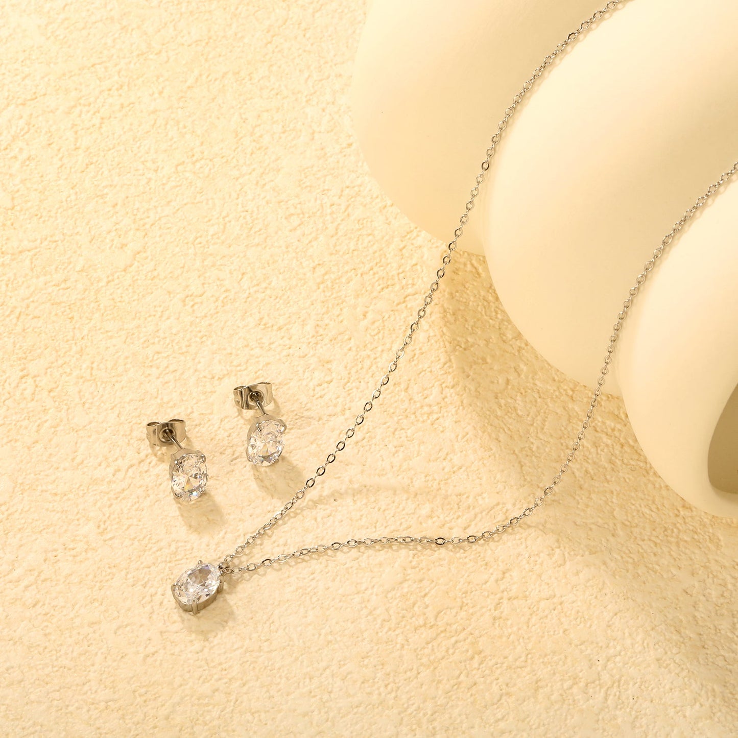 Oval Zirconia Set Gold/Steel Tone Studs: 6*8mm Pendant: 6*8mm 0.3ct Cross Chain 40+5cm + 6mm Round Tag asonjewelry