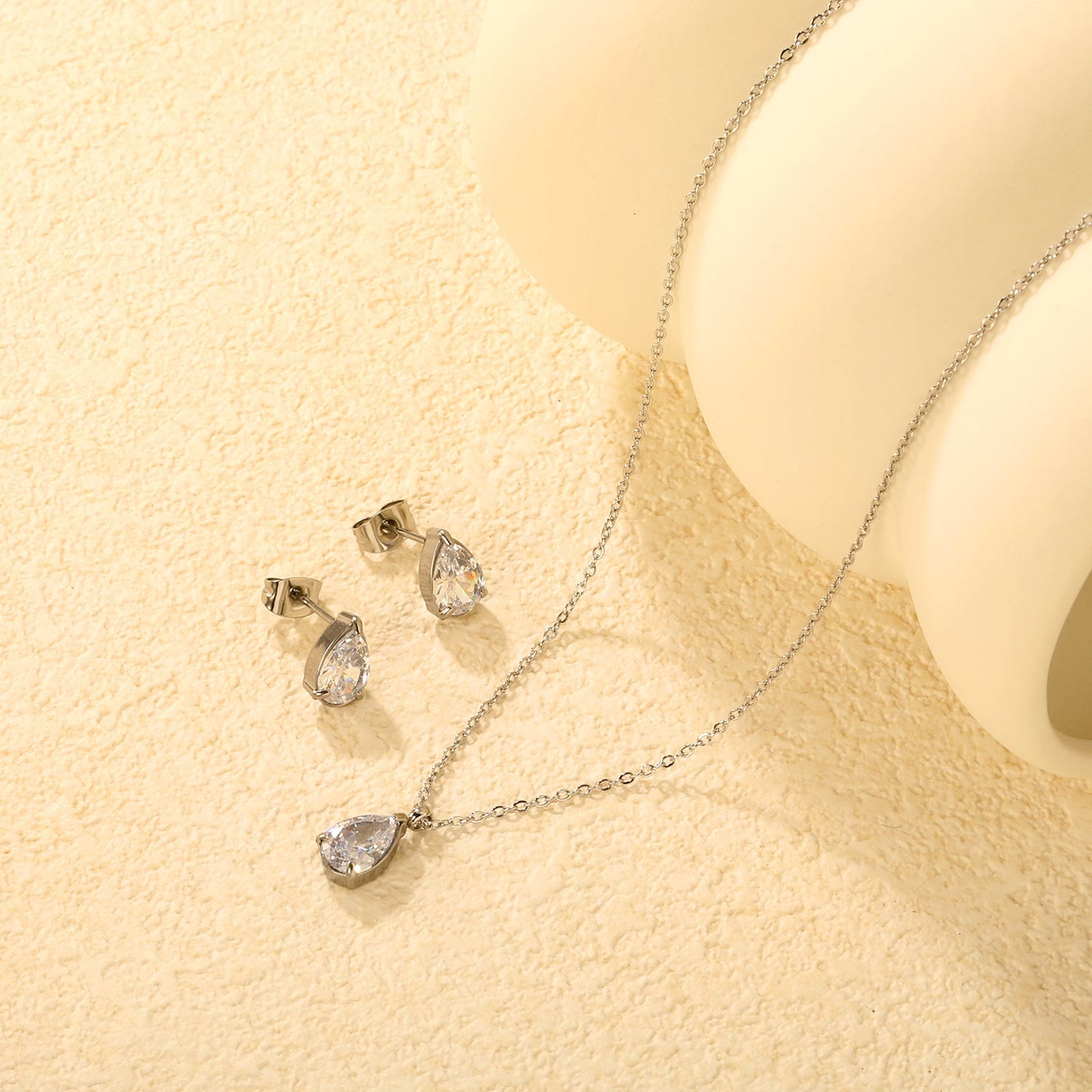 Teardrop White Zircon Set Gold/Steel-Tone Studs: 6.1*9.4mm Pendant: 6.1*9.4mm 0.3ct Cross Chain 40+5cm + 6mm Round Tag asonjewelry