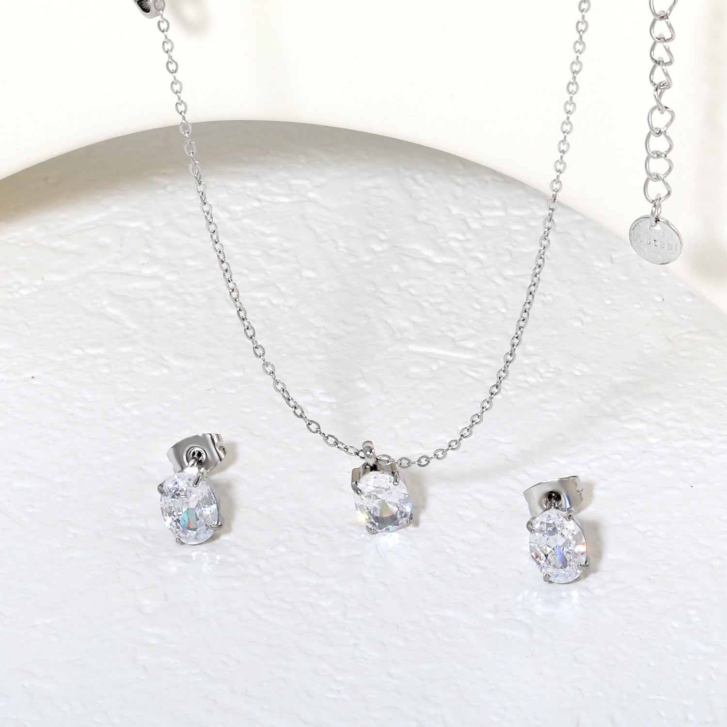 Oval Zirconia Set Gold/Steel Tone Studs: 6*8mm Pendant: 6*8mm 0.3ct Cross Chain 40+5cm + 6mm Round Tag asonjewelry