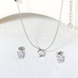 Oval Zirconia Set Gold/Steel Tone Studs: 6*8mm Pendant: 6*8mm 0.3ct Cross Chain 40+5cm + 6mm Round Tag