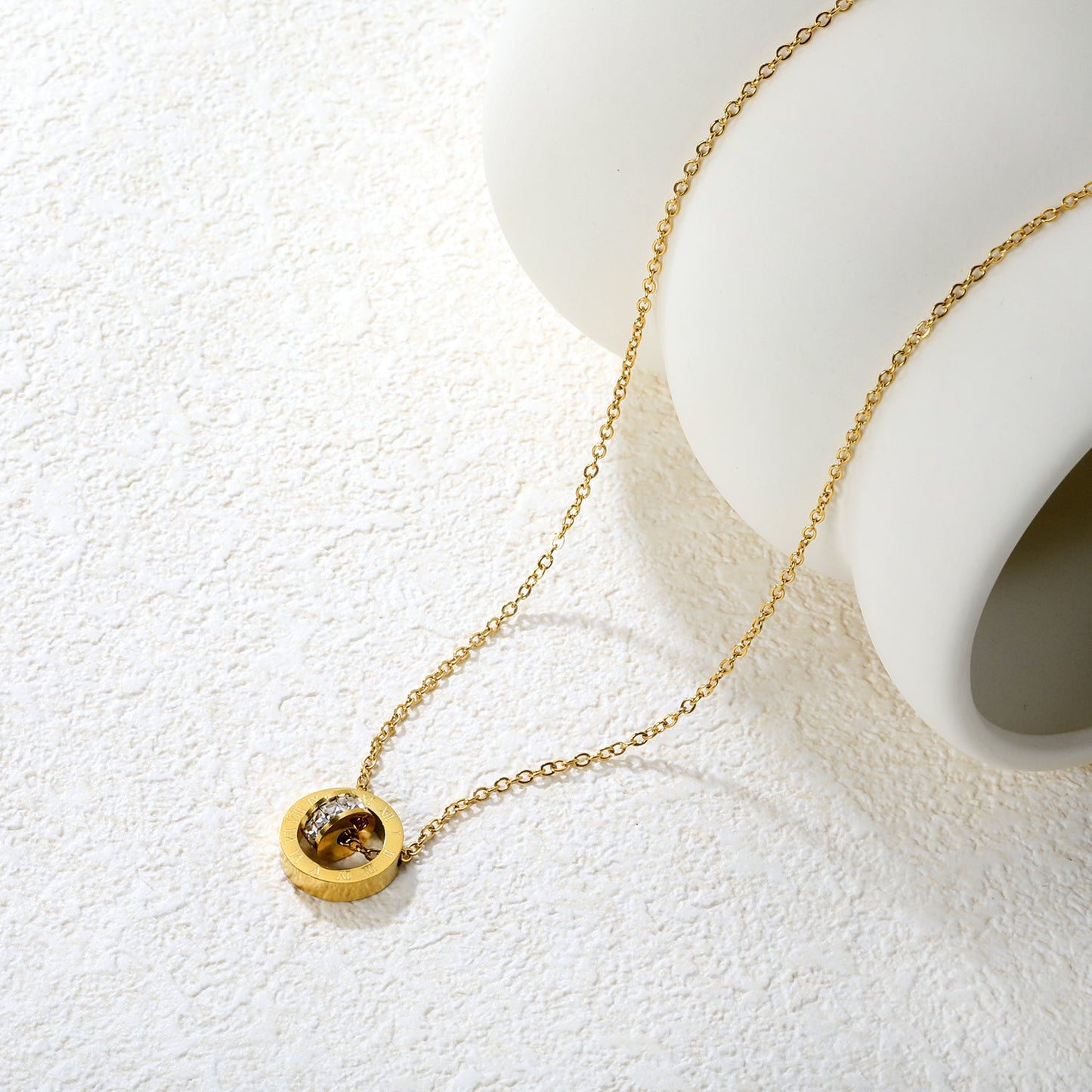 Diamond-set design necklace engraved with Roman numerals, gold asonjewelry