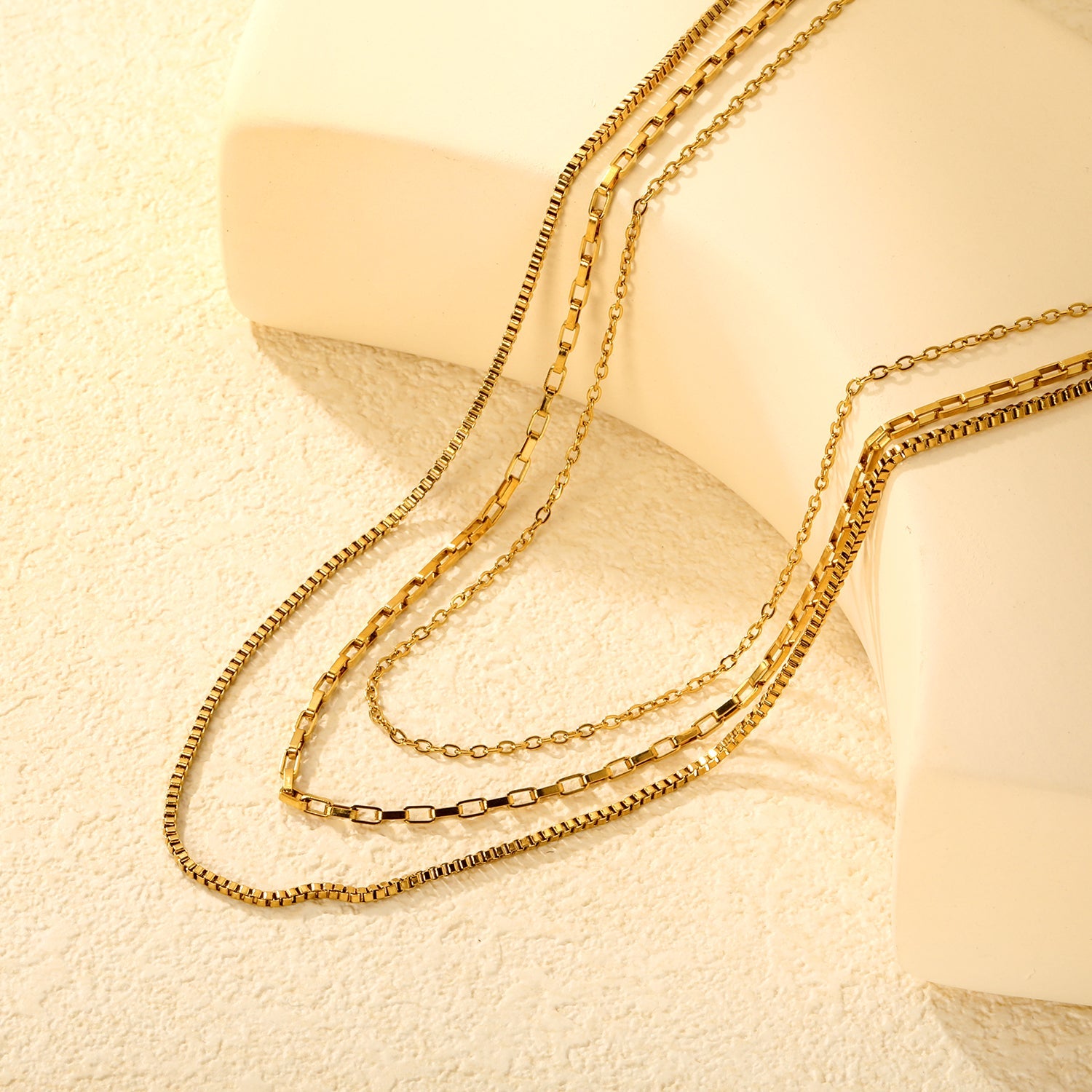 Three-tier combination necklace with distinct styles, gold asonjewelry