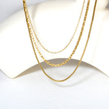 Three-tier combination necklace with distinct styles, gold