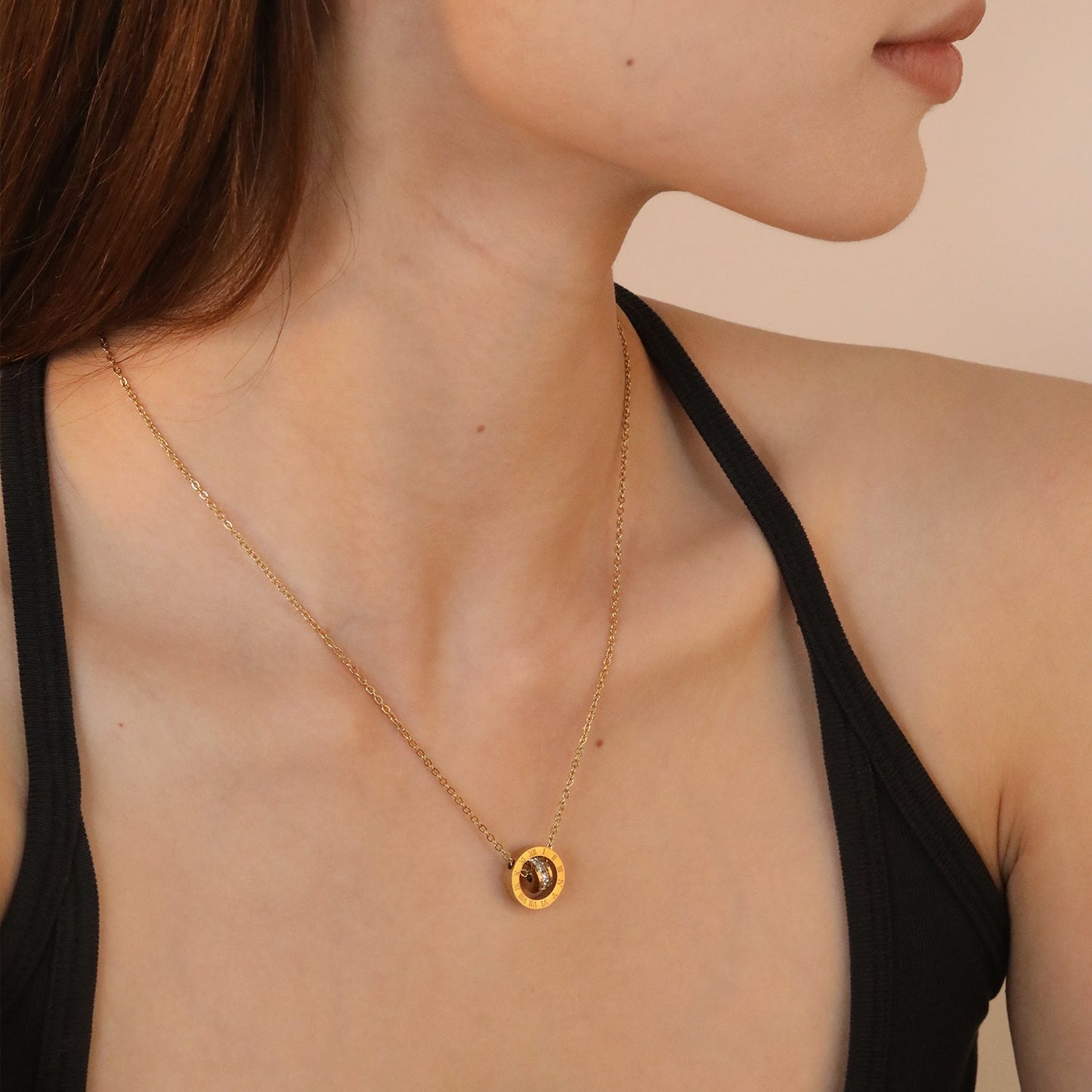 Diamond-set design necklace engraved with Roman numerals, gold asonjewelry