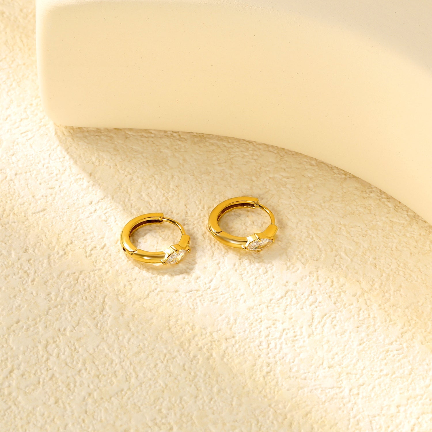 3.7 x 6.7mm diamond-shaped white zirconia stud earrings with a 2.2mm post and a 10mm inner diameter, gold-colored asonjewelry