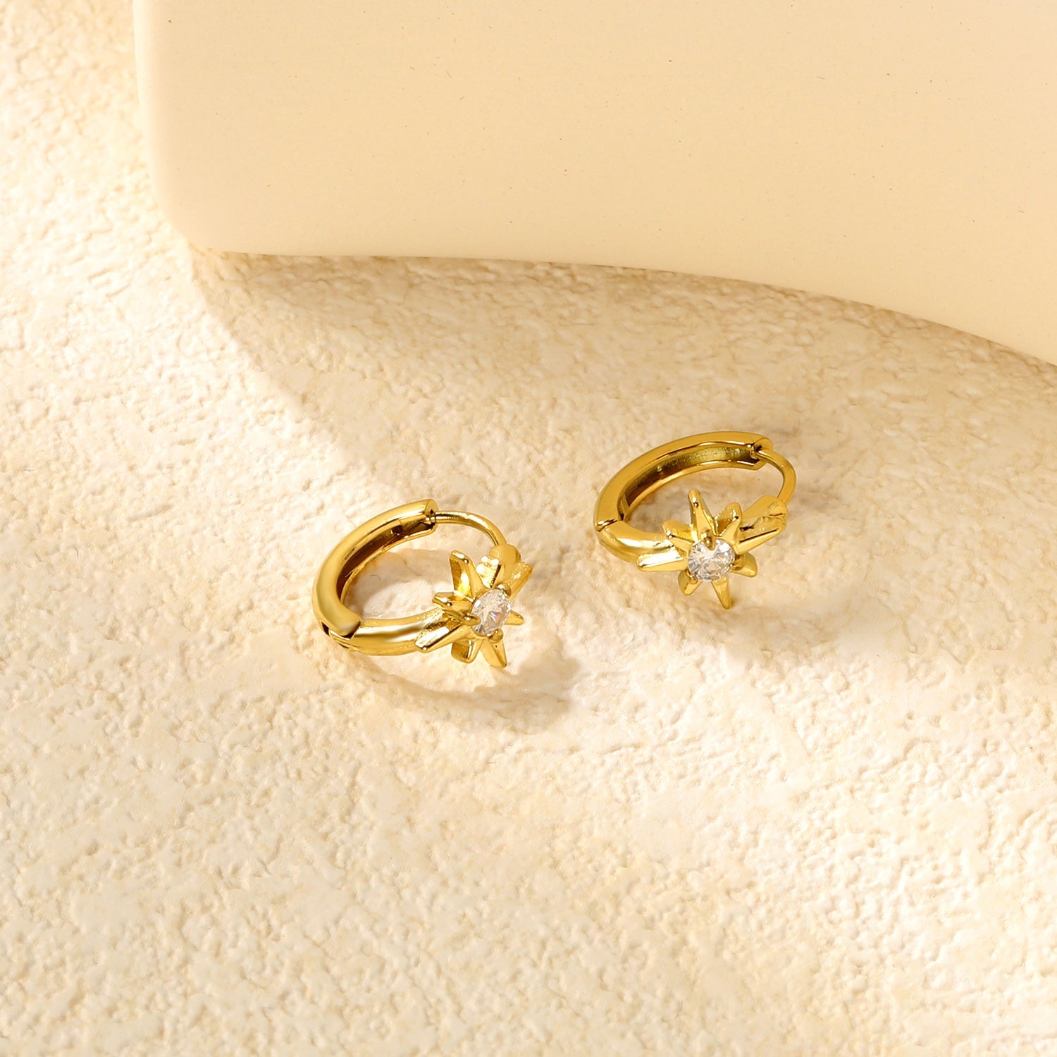 8.9 x 9.6mm eight-pointed star with white zirconia earring with 2.2mm earring post and 10mm inner diameter, gold-colored asonjewelry