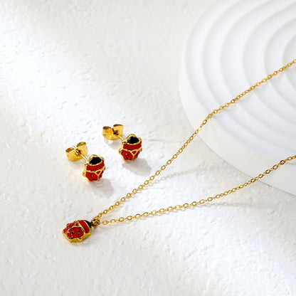 Seven star ladybug set Steel color/golden earrings: 7.3*8.2mm Pendant: 7.3*8.8mm0.3 Cross chain 40+5cm+6mm round plate asonjewelry