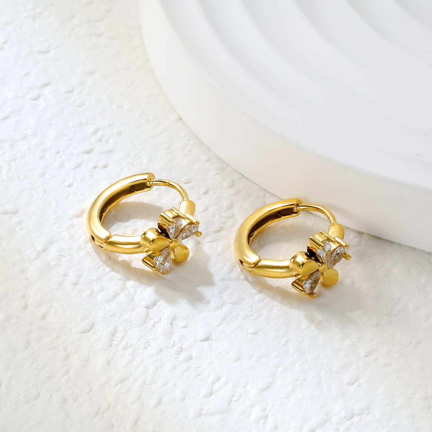 8mm flower-shaped earring with three white zirconia stones, 2.2mm post, and a 10mm inner diameter, gold color asonjewelry