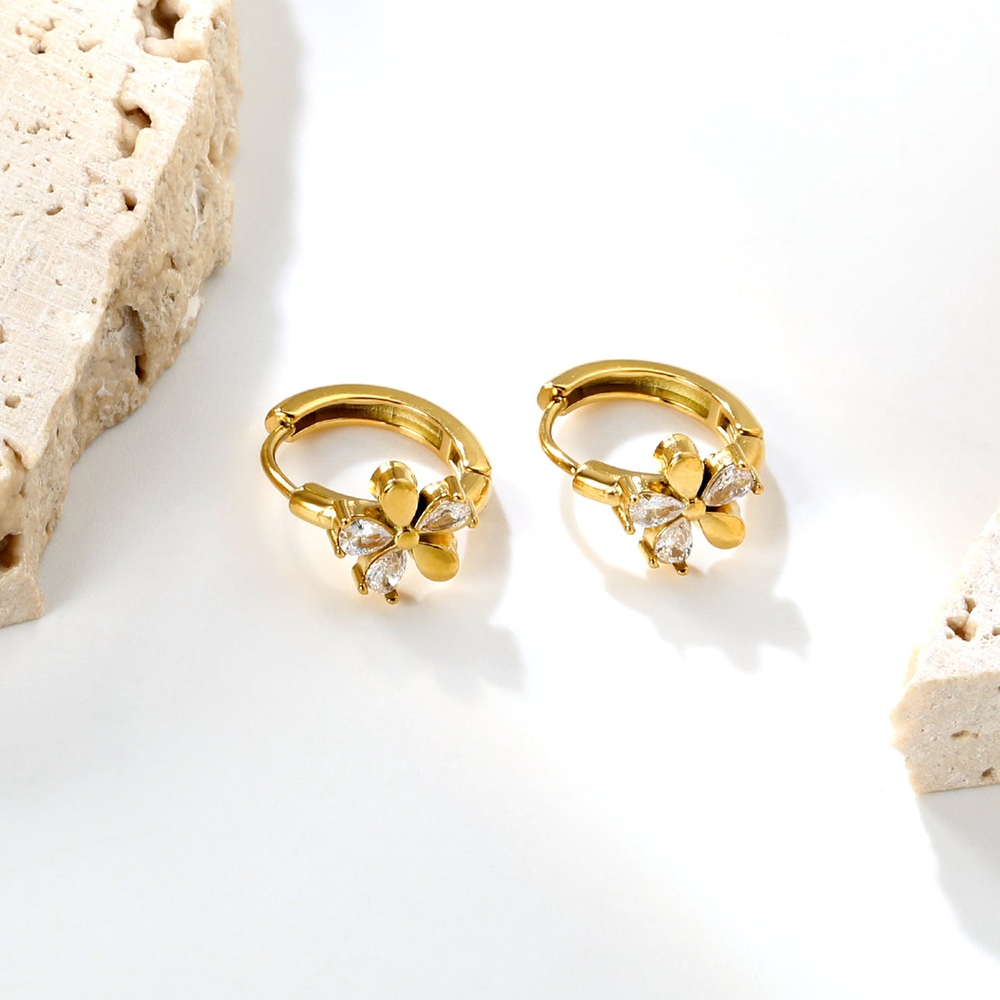 8mm flower-shaped earring with three white zirconia stones, 2.2mm post, and a 10mm inner diameter, gold color asonjewelry