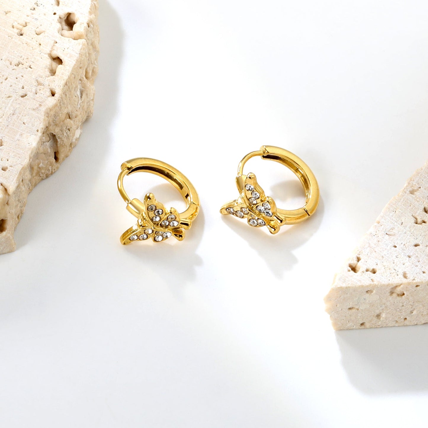 10.3 x 8.8mm butterfly-shaped white zirconia earring with a 2.2mm earring post and a 10mm inner diameter, gold-colored asonjewelry