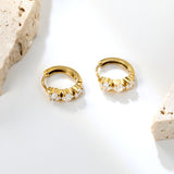 4.1 x 11.7mm three square white zirconia stud earrings with a 2.2mm post and a 10mm inner diameter, gold-colored
