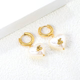 3x15mm circle with heart shaped white pearl + cherry stud earrings steel color / gold color