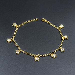 Pentagram shaped soft anklet in yellow gold with multicolored white diamonds
