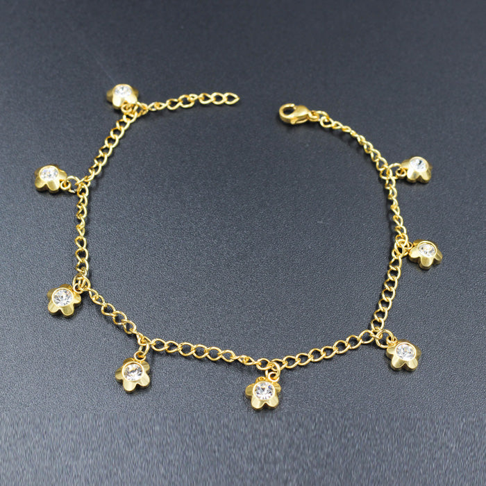 Gold colored soft anklet with multi diamond charms