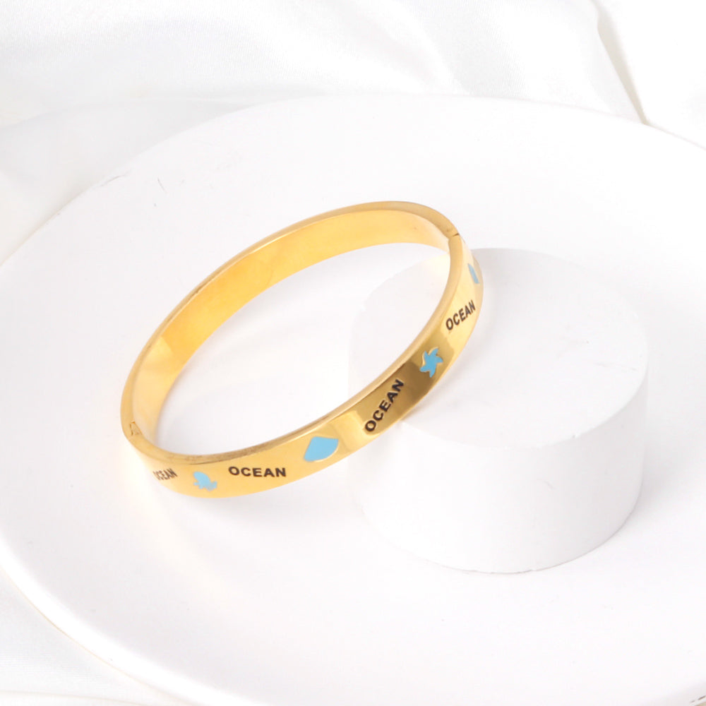 Hard bangle with blue scalloped dripping oils in a wide width asonjewelry