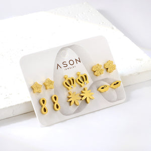 Six pairs of mixed card mounted cut-out frosted crown / lips stud earrings gold color