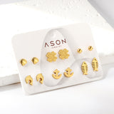 Six pairs of mixed card mounted cut-out shell / fishbone / dolphin stud earrings gold color