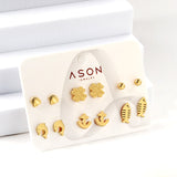 Six pairs of mixed card mounted cut-out shell / fishbone / dolphin stud earrings gold color