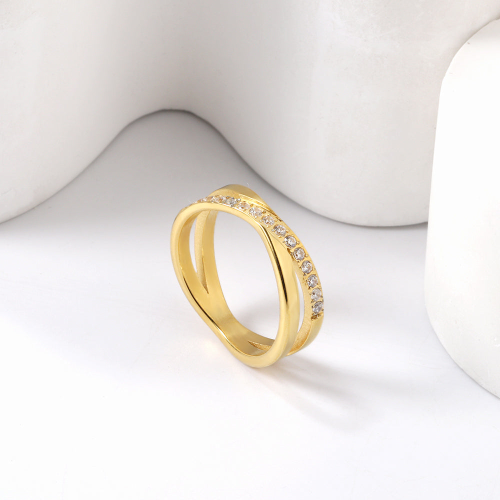 Steel/gold cross over ring with small round diamonds asonjewelry