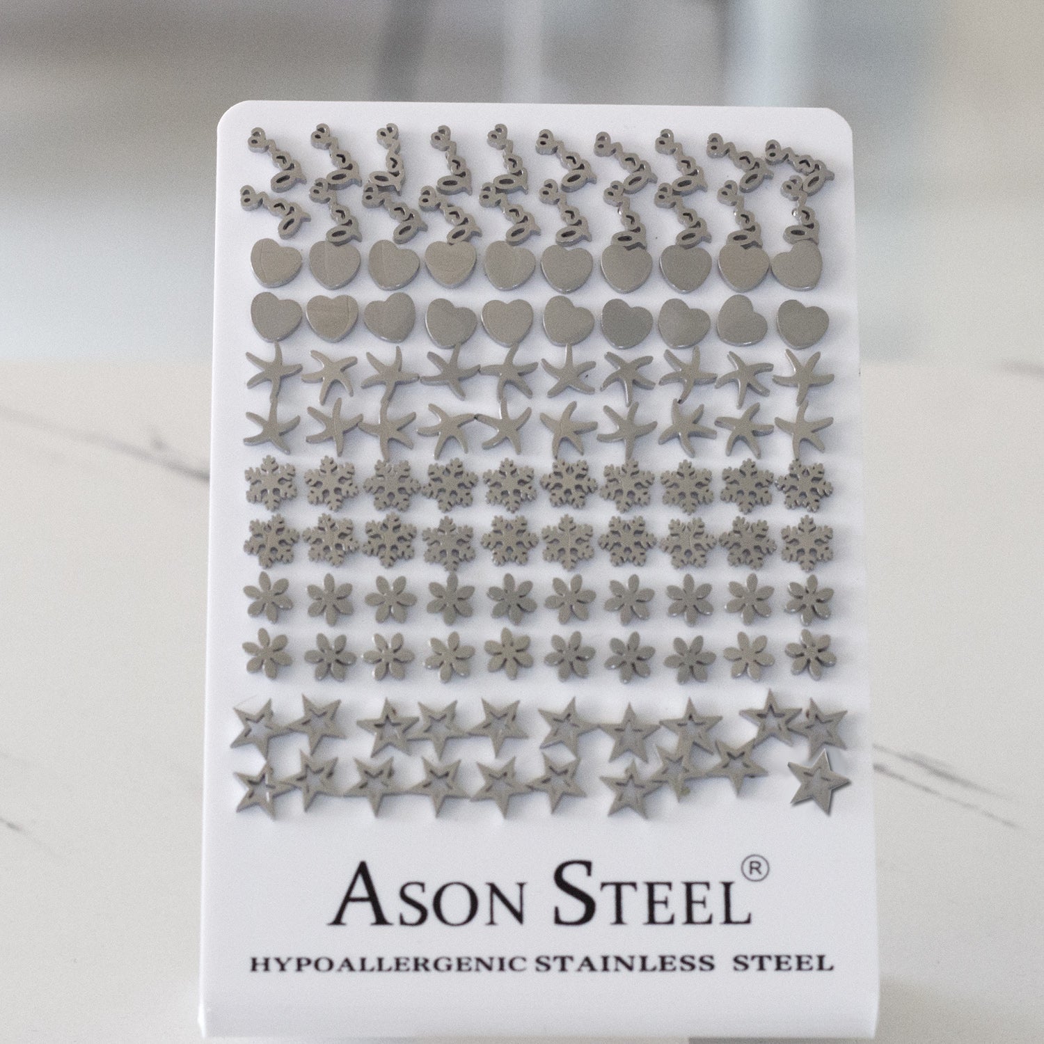 Steel color cross/rotary cut stud earrings without diamonds on card base asonjewelry