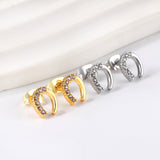 Gold U-shaped cut earrings with diamonds