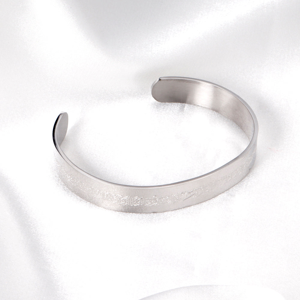 Extra wide hard open bangle in steel color with engraved surface asonjewelry