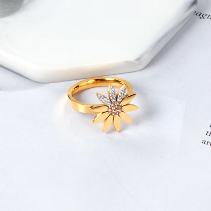 A large chrysanthemum with three leaves set with diamonds ring asonjewelry