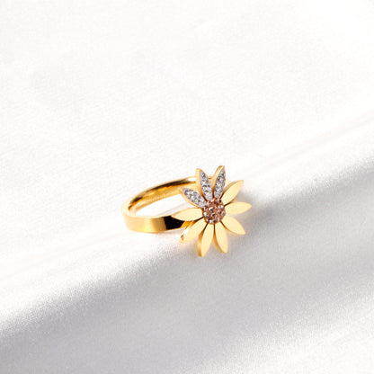 A large chrysanthemum with three leaves set with diamonds ring asonjewelry