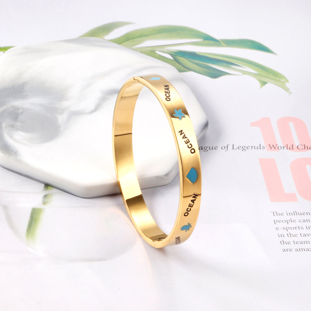 Hard bangle with blue scalloped dripping oils in a wide width asonjewelry