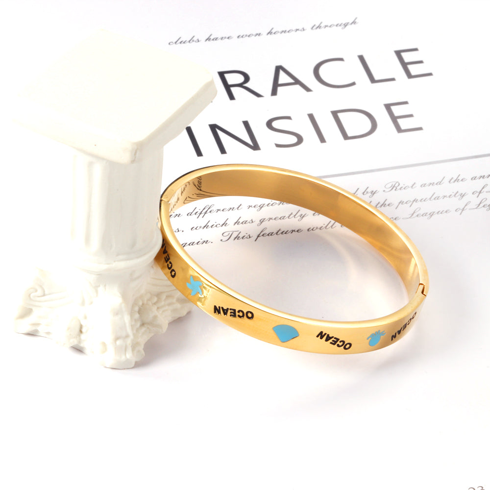 Hard bangle with blue scalloped dripping oils in a wide width asonjewelry