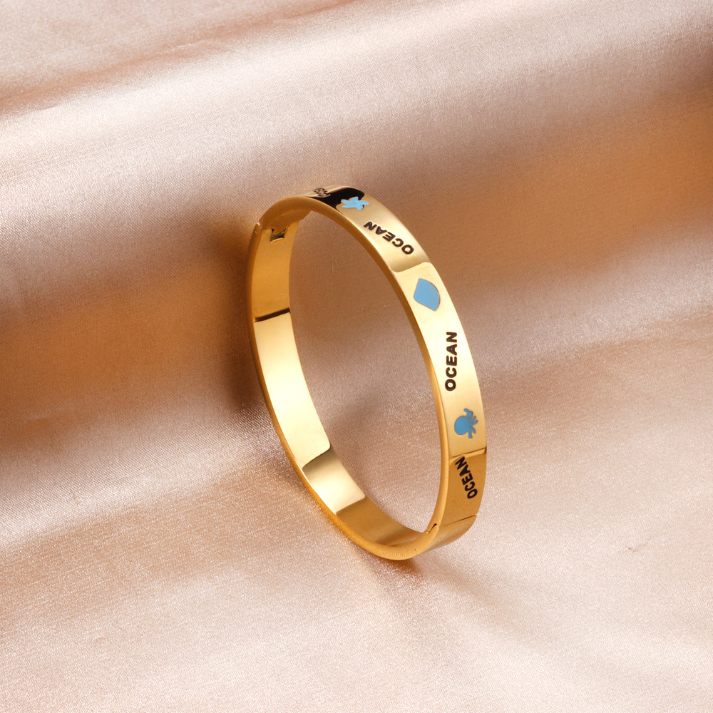 Hard bangle with blue scalloped dripping oils in a wide width asonjewelry