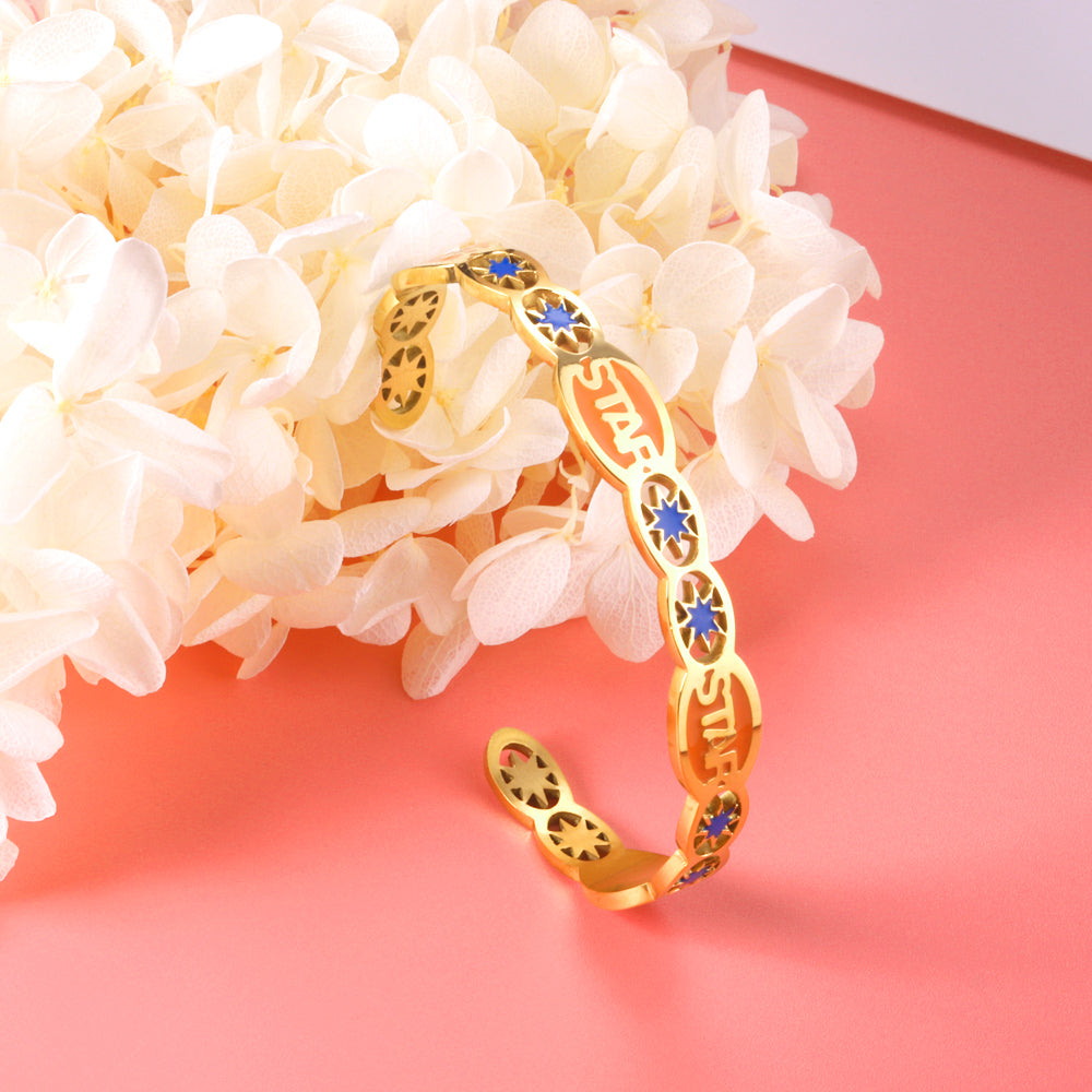 Hard bangle with many colors on the surface with drops of oil and shells in open gold color asonjewelry