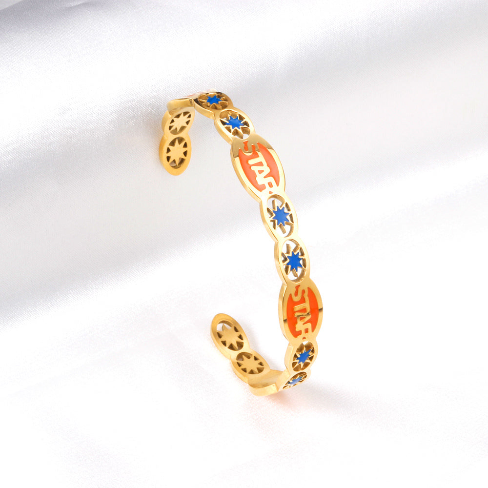 Hard bangle with many colors on the surface with drops of oil and shells in open gold color asonjewelry