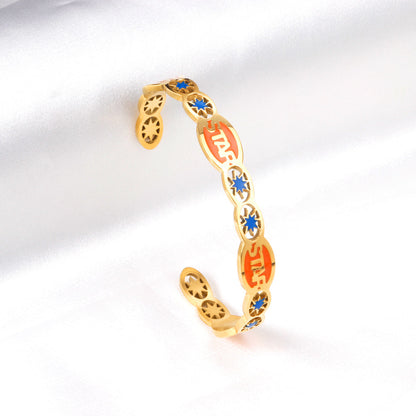 Hard bangle with many colors on the surface with drops of oil and shells in open gold color asonjewelry