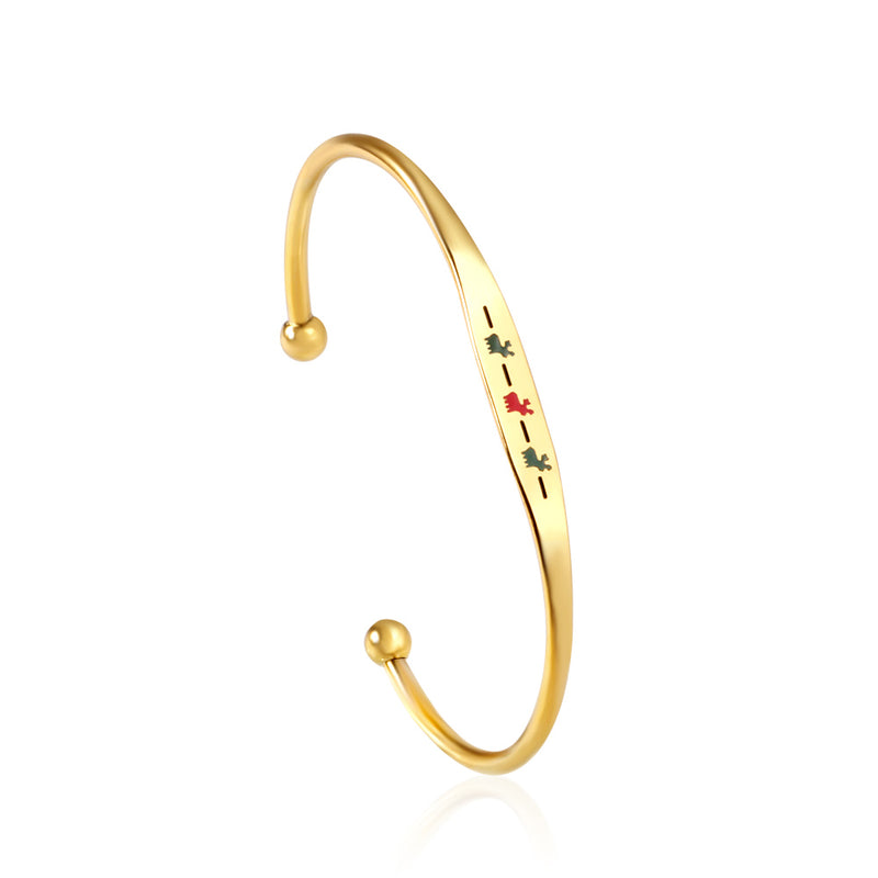 Hard bracelet with oil-drip pattern on gold-colored surface