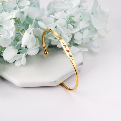 Hard bracelet with oil-drip pattern on gold-colored surface asonjewelry